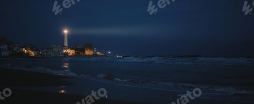 Preview: Light beam of the lighthouse in the night