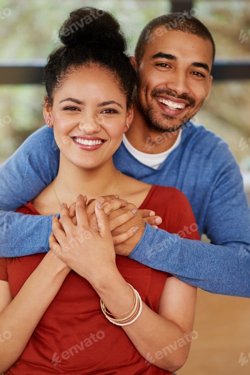 Preview: Living with the love of my life. Portrait of a happy young couple embracing at home.