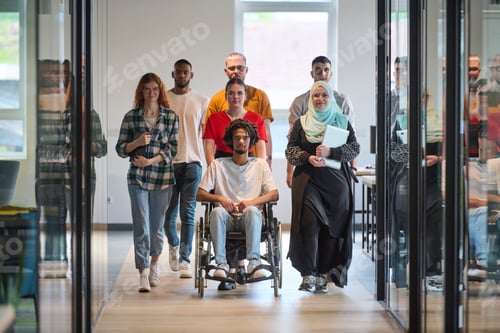 Preview: A diverse group of young business people congregates within a modern startup's glass-enclosed office