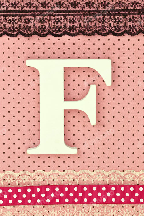 Preview: Wooden letter F on polka dots background