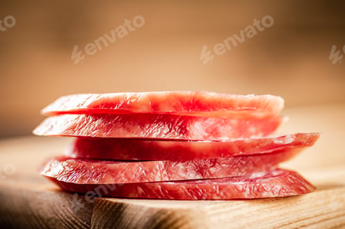 Preview: Sliced delicious salami sausage on the table.