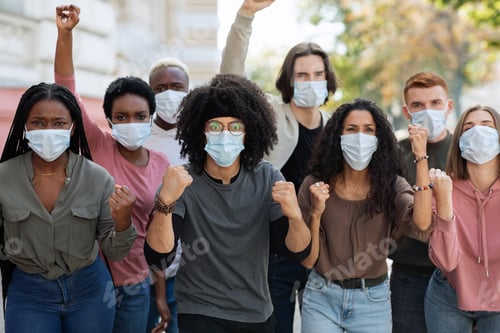 Preview: People wearing protective face mask protesting and showing fists