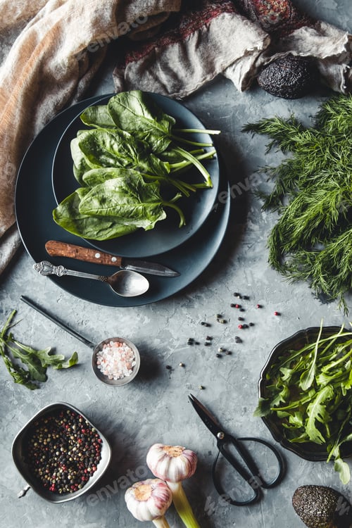 Preview: Bunch of fresh homegrown organic dill, spinach, arugula and spring onion on rustic wooden table