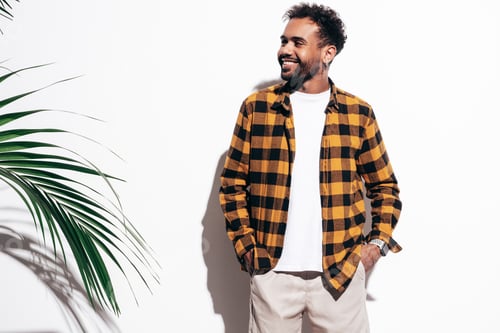 Preview: Portrait of young handsome man posing in studio