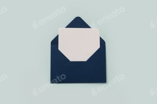 Preview: Blue paper envelope on blue background. View from above.