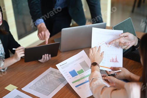 Preview: Group of business people discussing new project or startup idea together in meeting room.