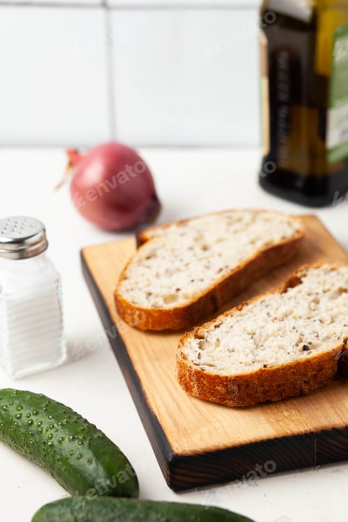 Fresh Bread Slices with Cucumber and Red Onion