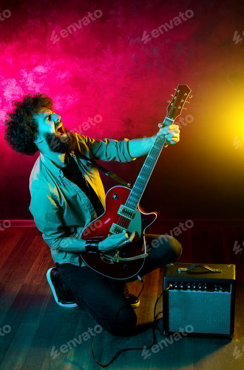 Preview: Passionate Musician Playing Electric Guitar With Energy