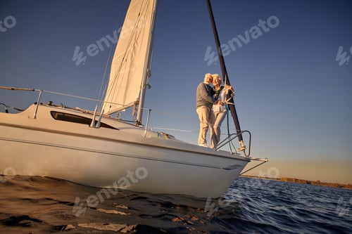Preview: Full length of a romantic retired couple, senior man and woman standing on the side