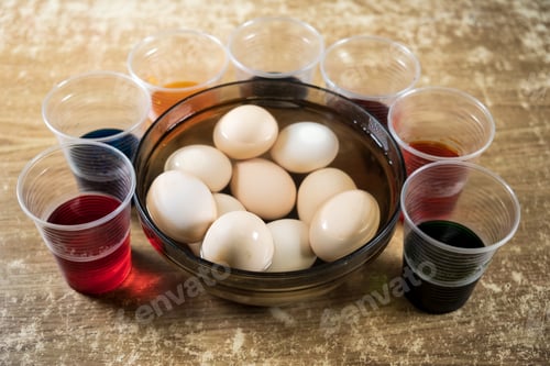 Preview: Easter eggs and colored liquid paints on the table