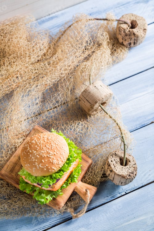 Preview: Fresh sandwich with fish and vegetables on old wooden table