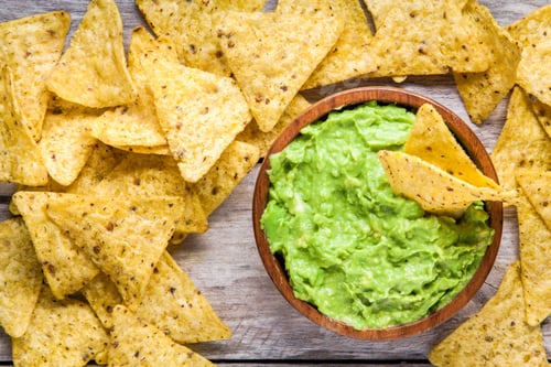 Preview: homemade guacamole with corn chips top view