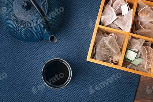 Preview: Traditional tea ceremony setup, teapot and teacup with Herbal tea bags