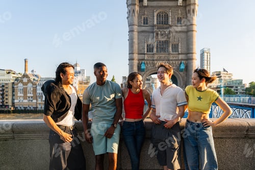 Preview: Multiracial group of happy young friends bonding in London