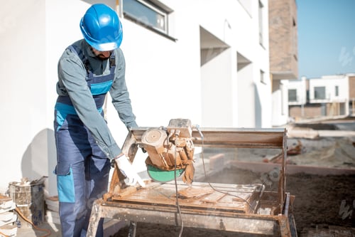 Preview: Man with electro saw on the construction site