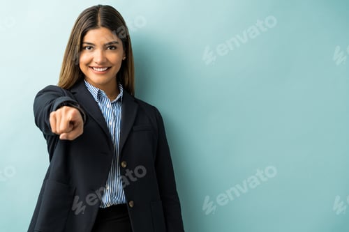 Preview: Smiling Female Latin Professional Gesturing At Studio