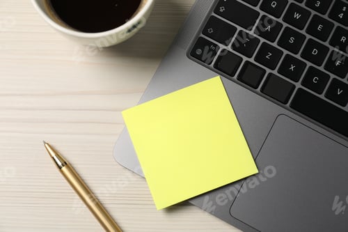 Preview: Sticky note, pen, coffee and laptop on wooden table, flat lay