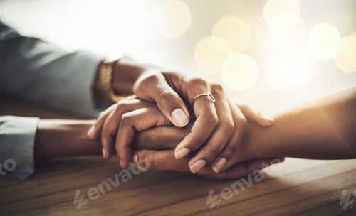Preview: You can tell me anything. Closeup shot of two women holding hands.