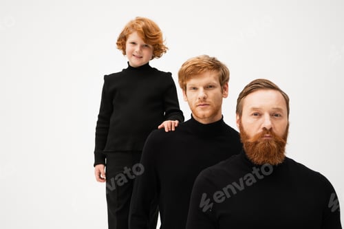 Preview: happy red haired boy touching shoulder of father near bearded grandpa isolated on grey