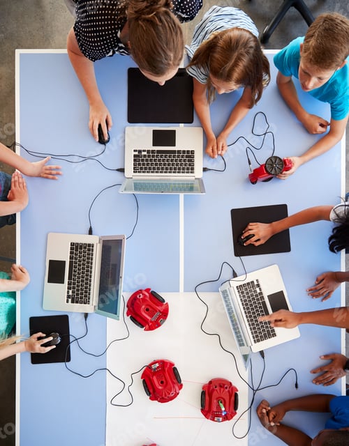 Preview: Overhead View Of Students In After School Computer Coding Class Learning To Program Robot Vehicle