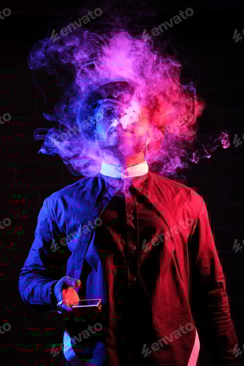 Preview: Ethnic man exhaling smoke on dark background