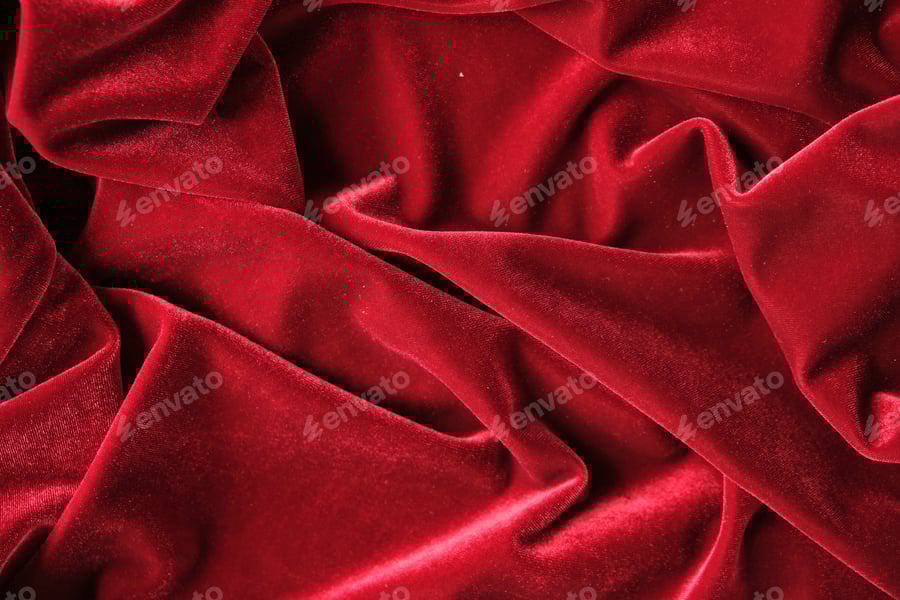 Cover for abstract texture of draped red velvet background. eautiful textile backdrop. Close-up. Top view