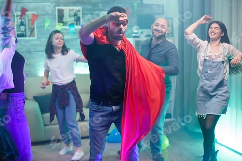 Preview: Young man enjoying time at party with his friends