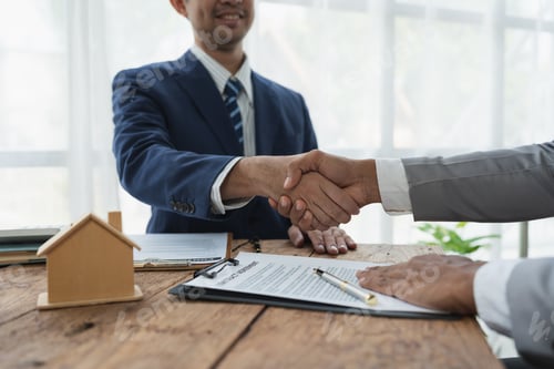 Preview: Handshake of real estate brokers with customers or investors, mortgage loan agreements Make a lease-