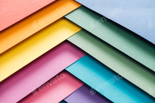 Preview: blue, orange, green, burgundy, yellow, pink and purple sheets of paper with copy space