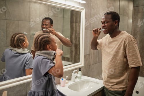 Preview: Father and Daughter Brushing Teeth