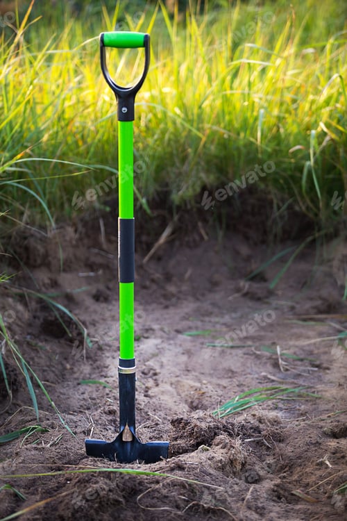Preview: Shovel is inserted into the ground for planting in the spring. Springtime, garden plants