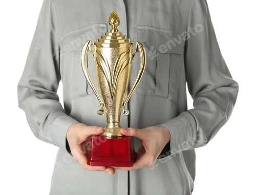Preview: Woman with golden trophy cup on white background, closeup