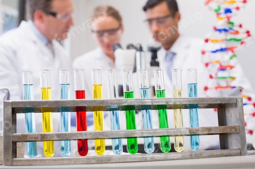 Preview: Scientists Working Attentively With Microscope In Laboratory