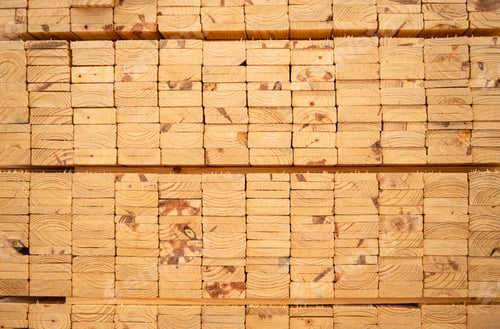 Preview: Wooden stacked in a warehouse, close-up. Wooden industrial background