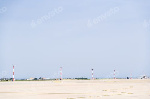 Preview: Bari, Italy - March 8, 2019: Airplane rolling down an airport runway.