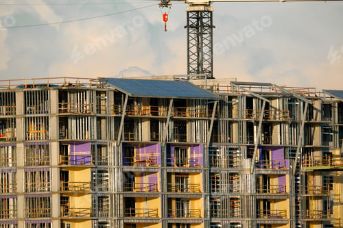 Preview: Tower lifting cranes at high residential apartment buildings construction site.