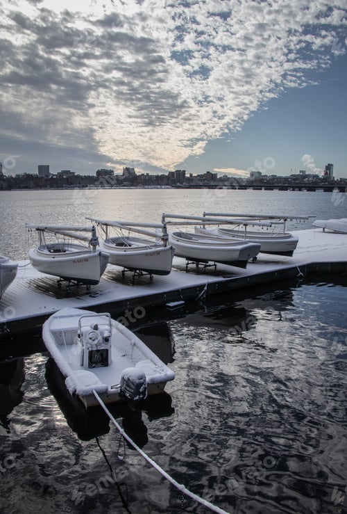 Preview: Vertical of boats covered in snow along the Charles river.