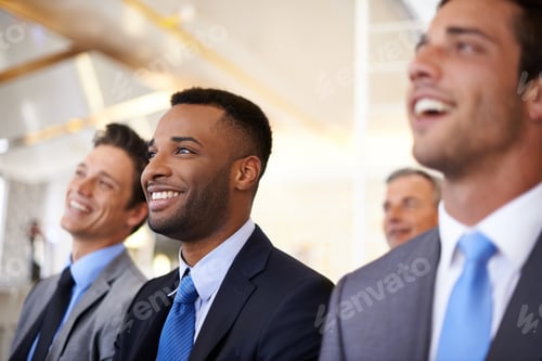 Preview: Cropped shot of a group of businesspeople listening to a work presentation