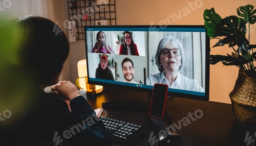 Preview: Multi generational business woman having video call with colleagues using computer app