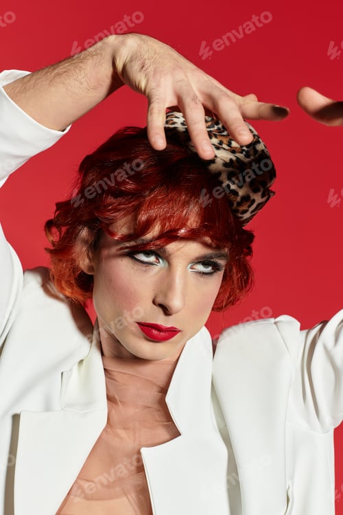 Preview: A striking young man with red hair expresses artistic flair while wearing a stylish hat.