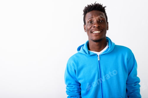 Preview: Close up of young happy black African man smiling against white