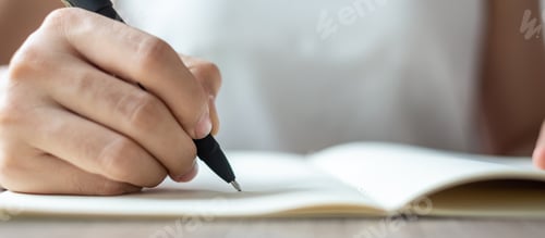 Preview: woman writing on notebook, hand of woman holding pen with signature on paper report