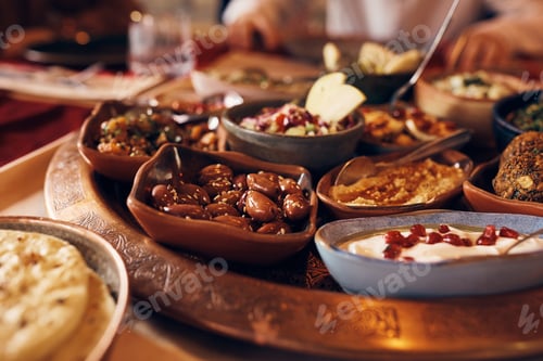 Preview: Close-up of Middle Eastern food at dining table.
