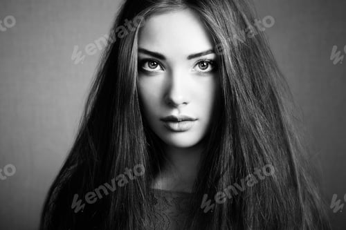 Preview: Portrait of beautiful dark-haired woman close up.