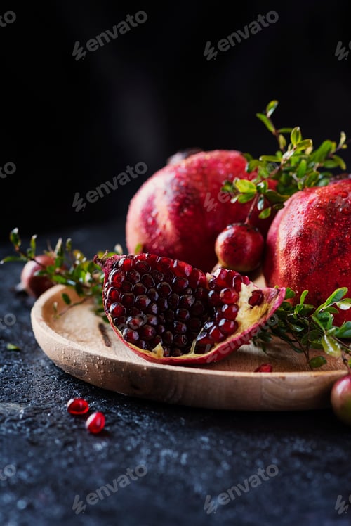 Preview: Sweet red pomegranate with green leaves