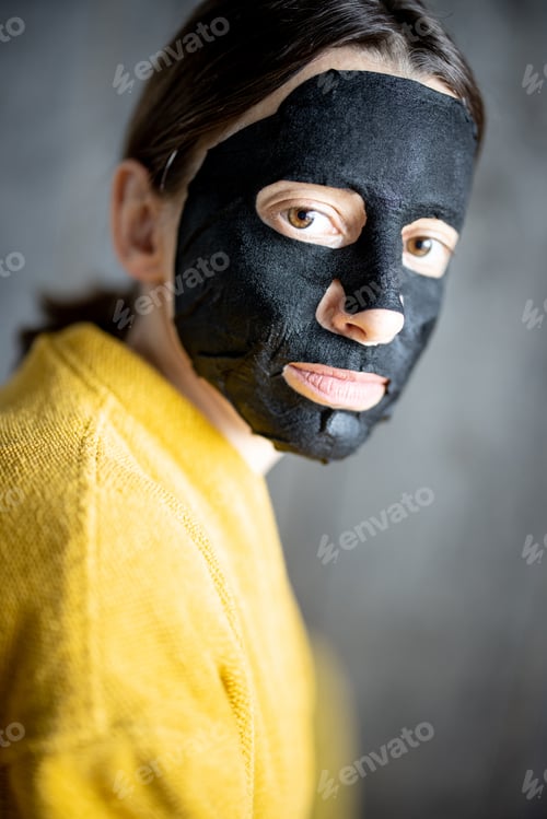 Preview: Woman with cleansing black mask on her face