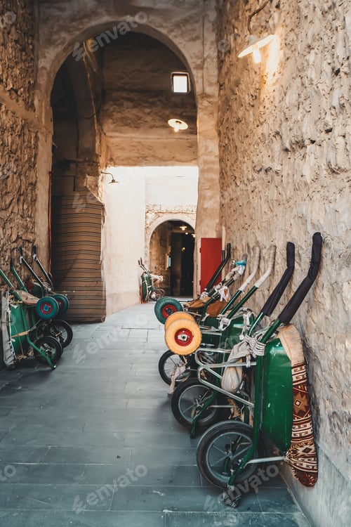 Preview: A few pushcarts of porters stored near the wall at the traditional old market