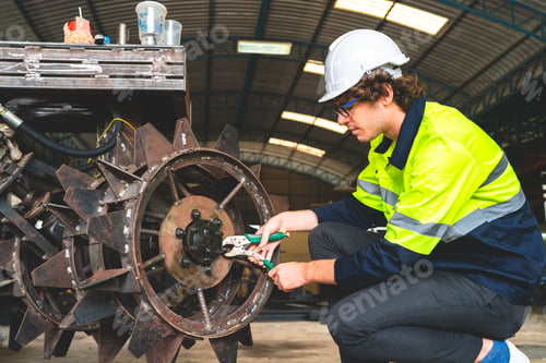 Preview: professional technician engineer with safety working in industrial manufacturing factory