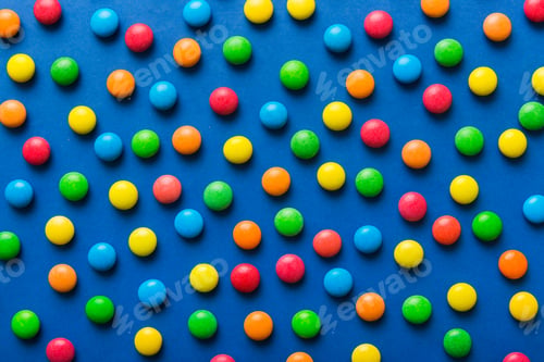 Preview: colorful candies as background top view. Seamless pattern with candy. Many sweet candies close-up