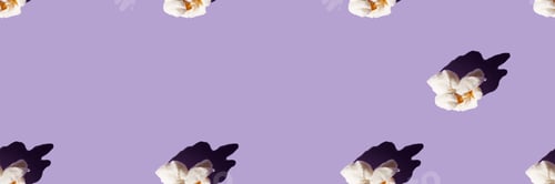 Preview: One popcorn on a purple background.